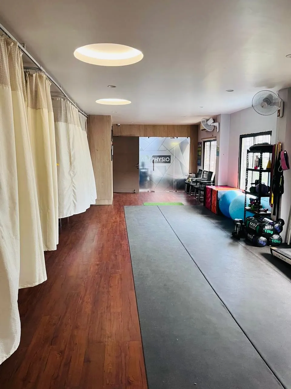 The treatment bays and exercise floor at the ABX Physio clinic in Guwahati